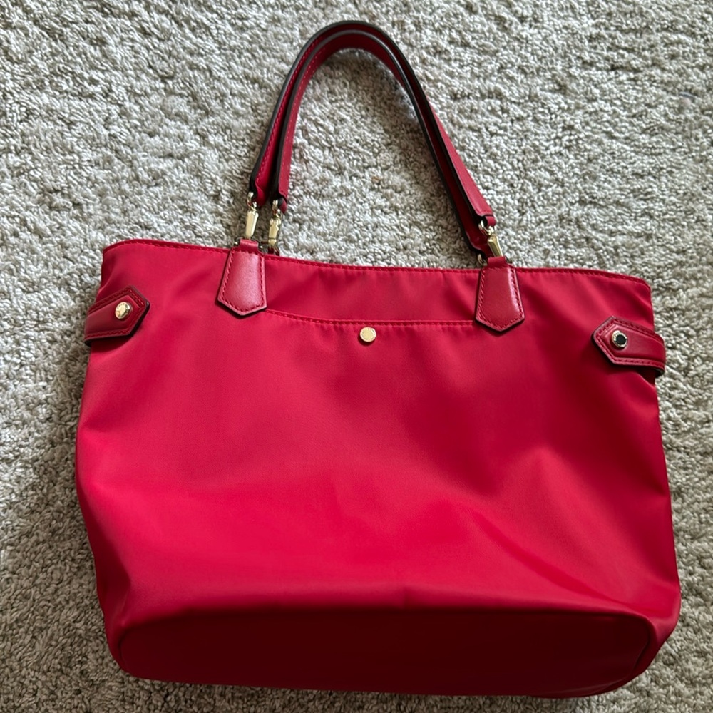 Pourchet Paris red tote with leather handles.